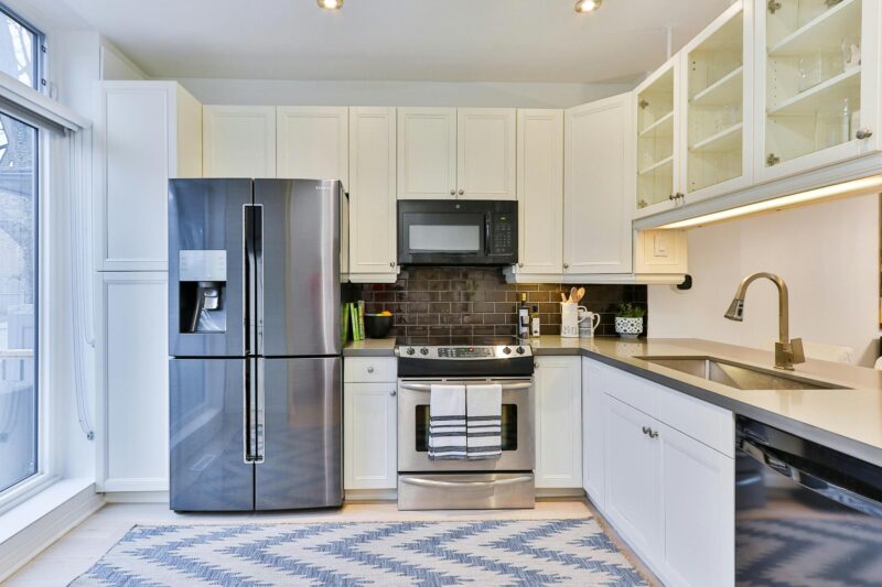 a kitchen with white cabinets